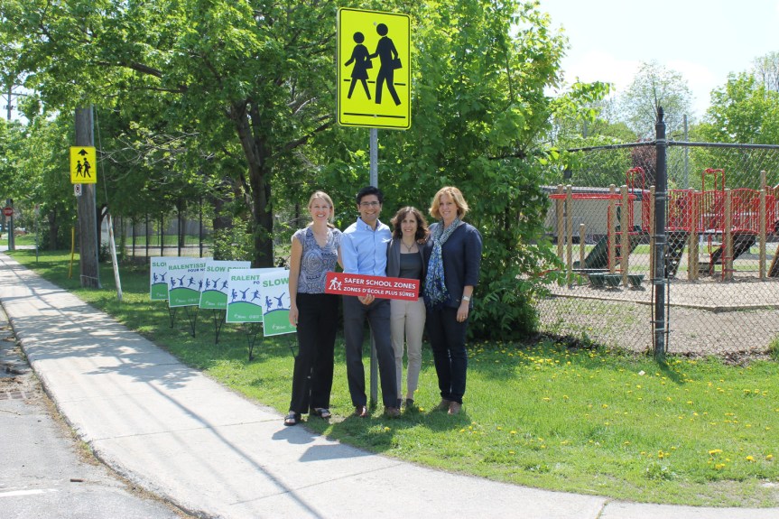 [Yasir Naqvi and supporters of the Safer School Zones Act]