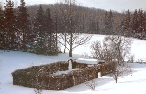 [Wattle fenced rectangular garden in winter]