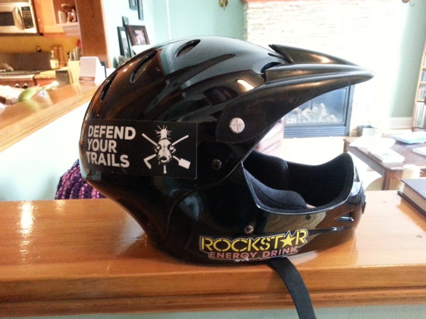 [Picture of a black plastic helmet]