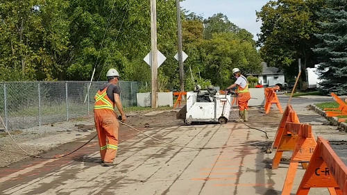 [Scoring the Pavement with a Circular Saw Cutter]